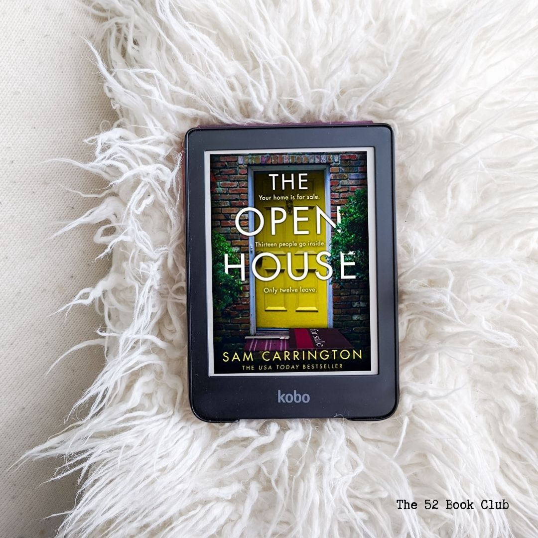 The Open House book cover on e-reader lying on a white fluffy pillow and background.