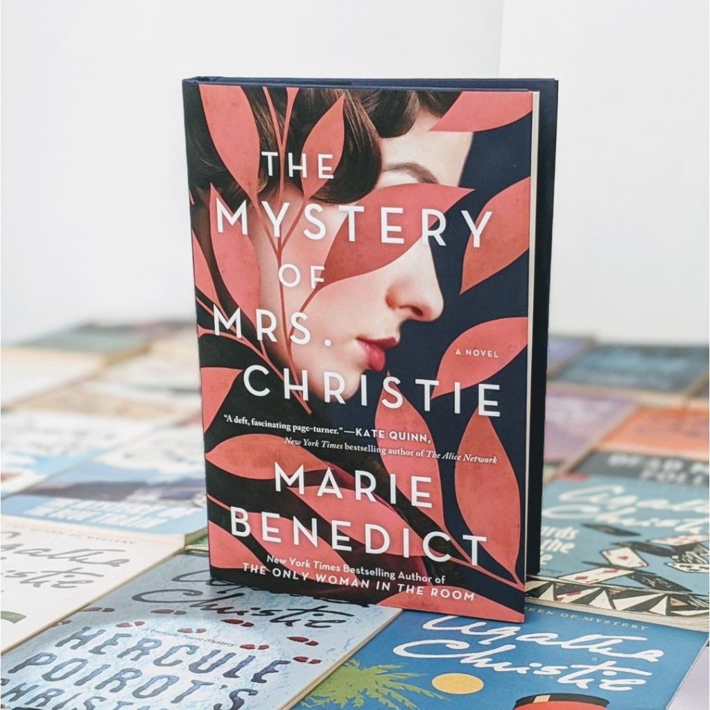 The Mystery of Mrs Christie hardcover book sitting on top of Agatha Christie novels