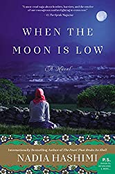 When the moon is low -- book cover with a woman facing away